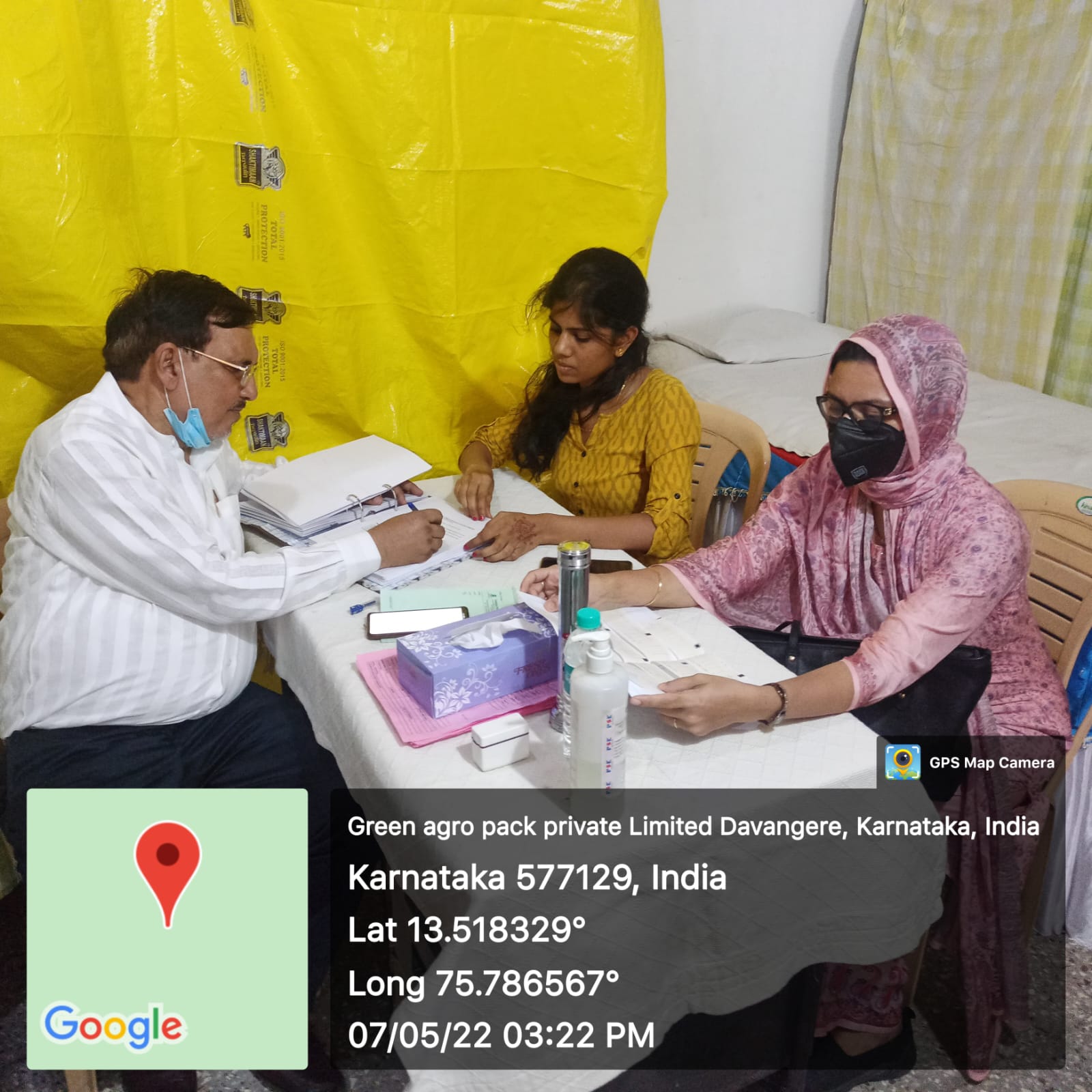 Dr. Mariam Anjum consulting at a health screening camp in Davangere